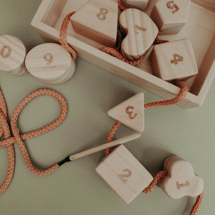 Wooden lacing toy with numbers and geometry shapes