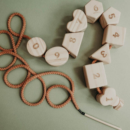 Wooden lacing toy with numbers and geometry shapes